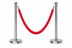 Two silver stanchions with a red velvet rope barrier